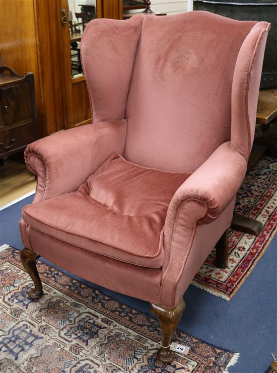 A walnut wing chair